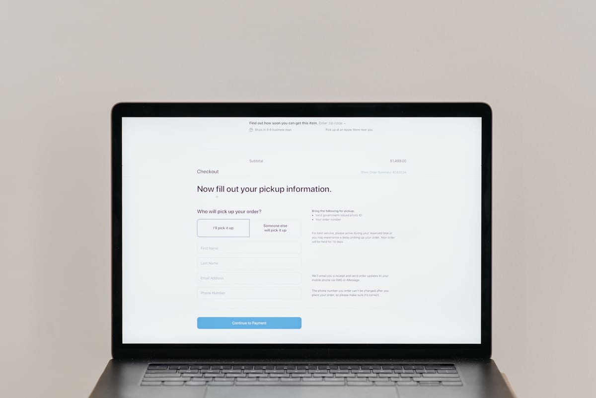 A laptop open to a modern business website